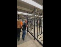 Guy carries cross in station