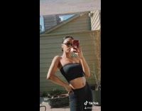 Girl takes mirror photos outside white shoes