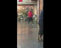 Woman in red jacket hoodie tiktok dance