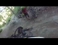 Guy falls forward off bicycle white helmet 