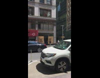 Lady poses boarded up building george floyd 