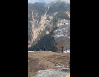 Man films video with thrown snow for effects