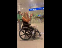 Woman on wheelchair performs trick on airport