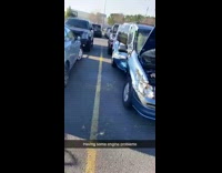 Blue minivan with large dent on side 