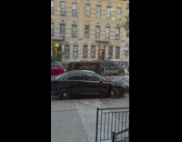 Car flipped over on it's side on the street