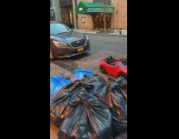 Small red toy car parked on street
