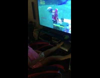 (3RD PARTY CONTENT) Little girl in pink playing fortnite red gaming chair