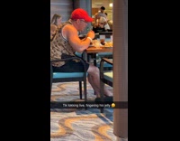 Man touches jelly for video inside restaurant