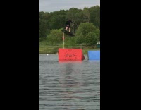 Guy white wakeboard red ramp three spins