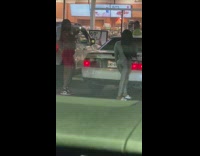 Woman silver tight suit sandals behind car