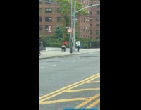 Woman wearing headphones dancing on sidewalk