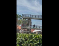 Man on deck spin rope around him