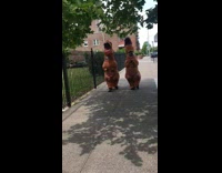 Collab WINY - Two people wear inflatable dinosaur costume street