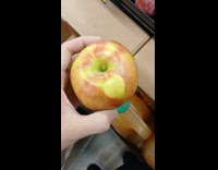 Man sees apple with apple mark shape