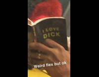 Man reads book called I love dick on subway train
