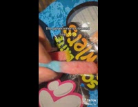 guy eating gummy word candy combines different colors