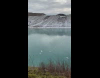 Lady Shows Rock and Throws it on Frozen Lake