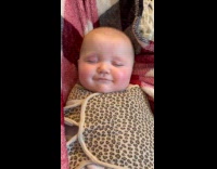 Baby reacts to mom talk while sleeping