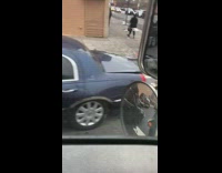 Blue burnt car parked on street 
