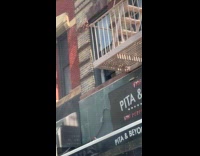 Kid throws random things outside apartment window