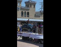 Guy yoga pose blue mat car roof 
