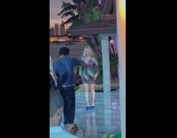 Woman in a shiny dress poses at the event floor Part 2