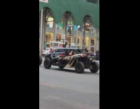 2 big blue go karts on street 