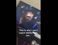 Girl sobs at netflix on black couch