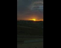 Time Lapse video of the city with roads and buildings in sunset