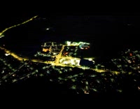 Drone shot electricity comes back town night