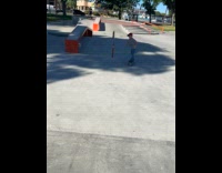 Kid rides the skateboard at the skatepark