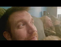 Woman laughs at Daily Dose of Internet video