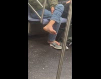 Passenger on train airing out feet