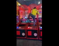 Guy climbs into basketball arcade game 