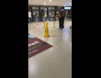 shirtless man carrying deer head