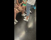 Train passenger with socks over jeans 