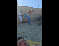 Woman yellow dress beach photoshoot with crew Part 2