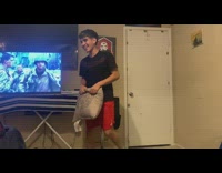 Couple have pillow fight in bedroom 