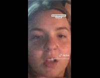 Girl comforts dog during storm 