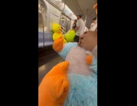 Men transporting huge stuffed toys on trian