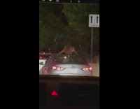 Girl dances outside of sunroof in car