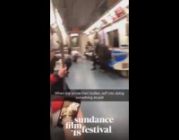 Guy gets down on the floor and rolls down the aisle on a subway train #BluePointWhatTheL