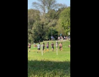 Group of guys play quadball at park