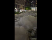 Foam bubbles on plaza water fountain night
