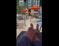 Two girls dance tiktok orange umbrella pool