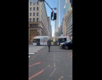 Donald Trump controls traffic in the intersection