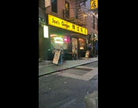 Person with creepy mask waiting at restaurant