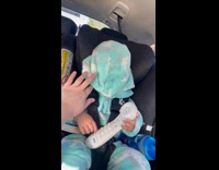 Kid pulls hood down while riding car