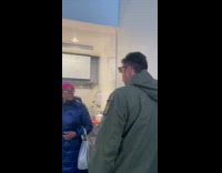 Woman spits on mans face at deli shop