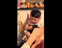 Collab Clips MPUGC - Woman colors dolls head with marker